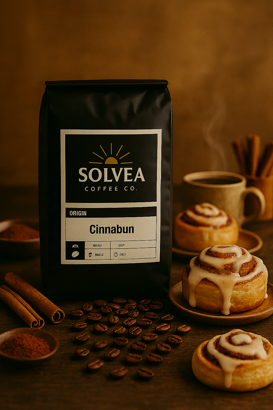 Solvea Coffee Co. bag with cinnamon rolls and coffee beans on a wooden surface.